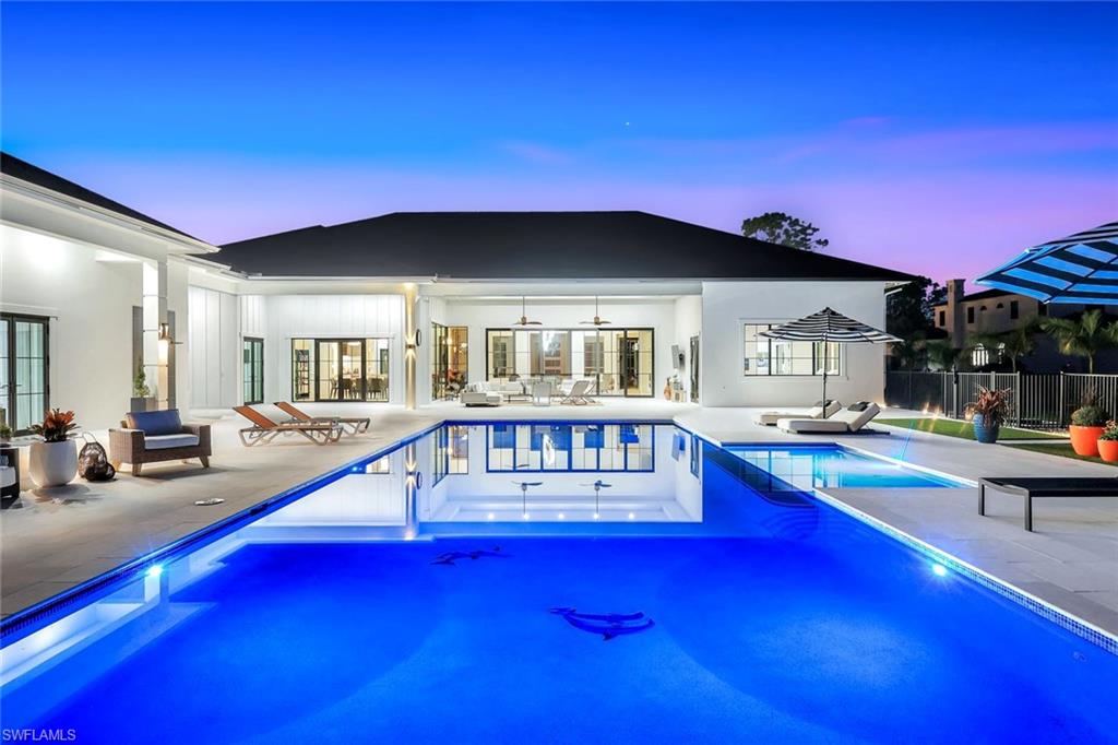 6677 Hunters Road Naples, FL 34109 - Photo 12 of 50 a view of swimming pool with chairs