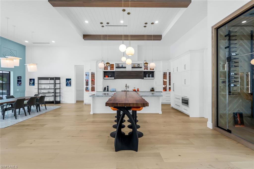 6677 Hunters Road Naples, FL 34109 - Photo 20 of 50 a room with furniture and a large mirror