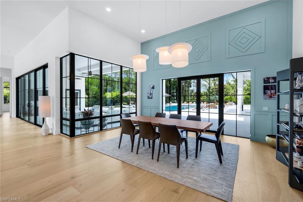 6677 Hunters Road Naples, FL 34109 - Photo 23 of 50 a view of a dining room with furniture window and outside view
