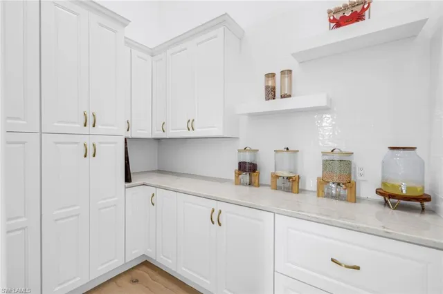 a kitchen with cabinets and window