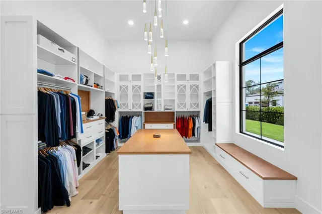 a very nice looking room with a large window and flat screen tv