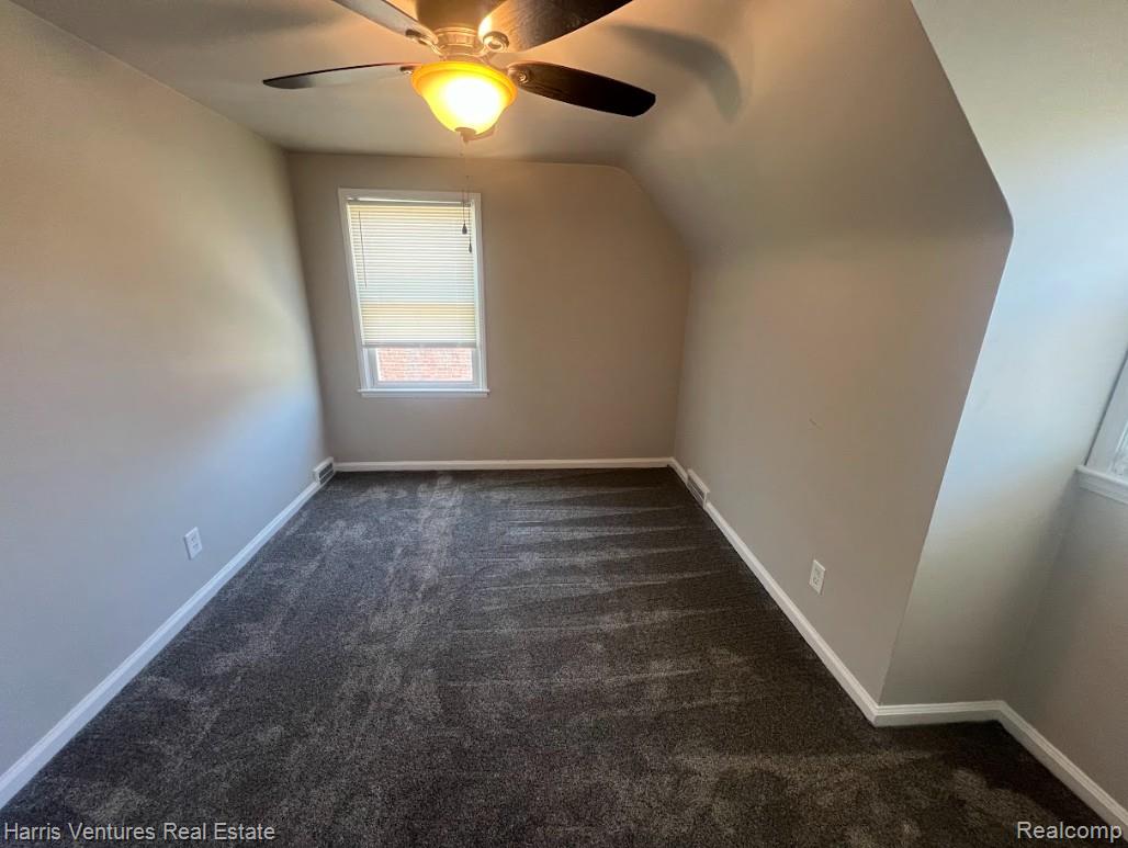 22144 Moross Road Grosse Pointe, MI 48236 - Photo 12 of 16 Carpeted room featuring a ceiling fan with integrated lighting, a single window with blinds, and neutral wall tones