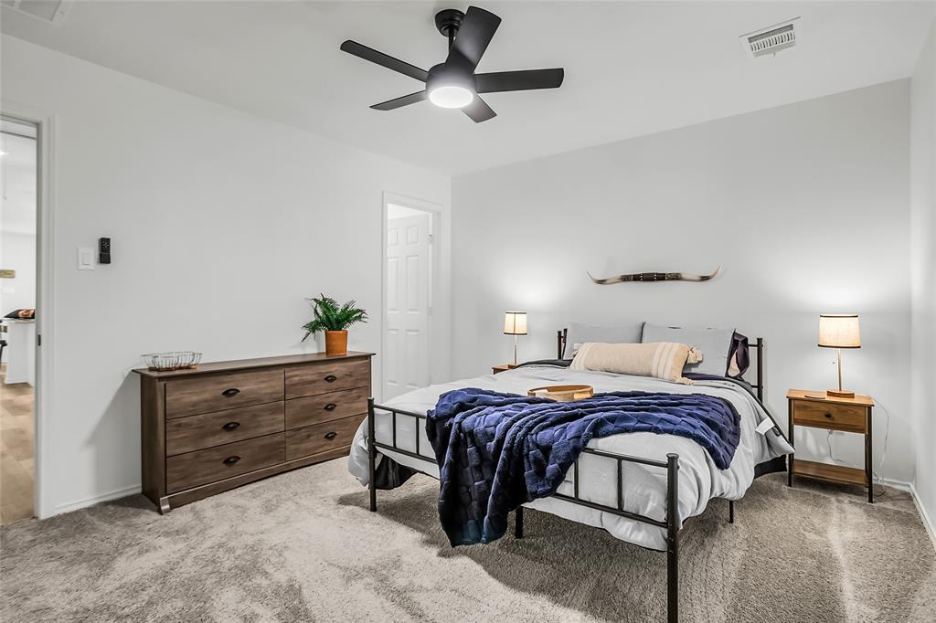 308 South 3rd Street Bonham, TX 75418 - Photo 17 of 19 a bedroom with a bed and a ceiling fan