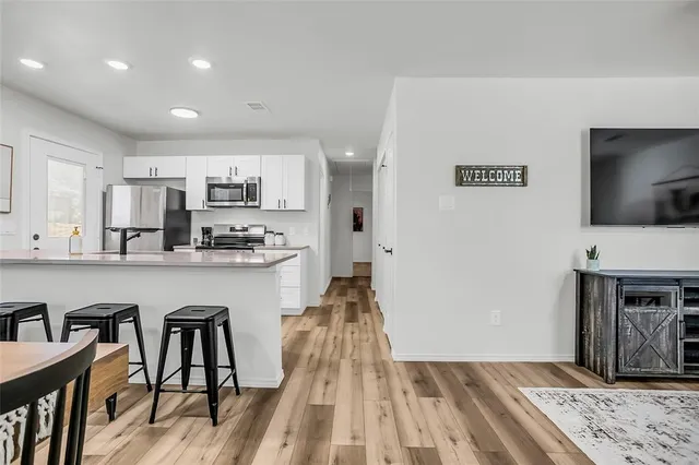 a kitchen with granite countertop lots of counter top space and stainless steel appliances
