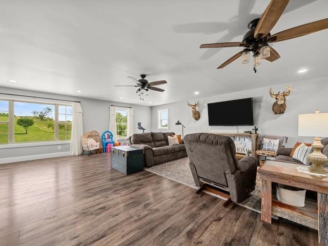 8294 North Leaf River Road Leaf River, IL 61047 - Photo 25 of 56 a living room with furniture and a flat screen tv