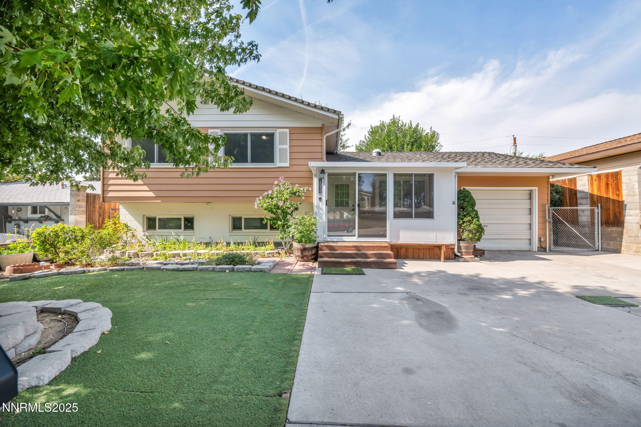 3570 West 7th Street Reno, NV 89503 - Photo 1 of 45 a front view of a house with a garden and porch