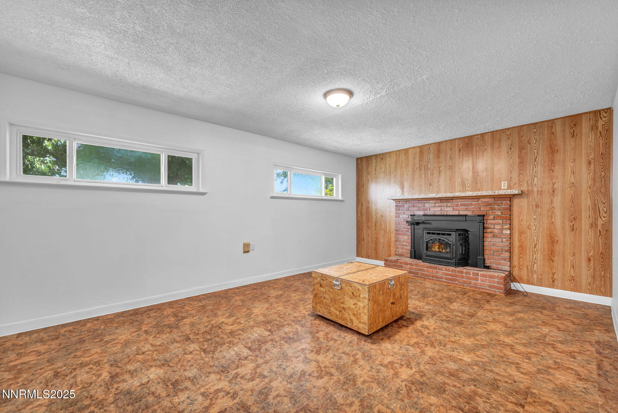 3570 West 7th Street Reno, NV 89503 - Photo 24 of 45 a view of an empty room with a fireplace and a window