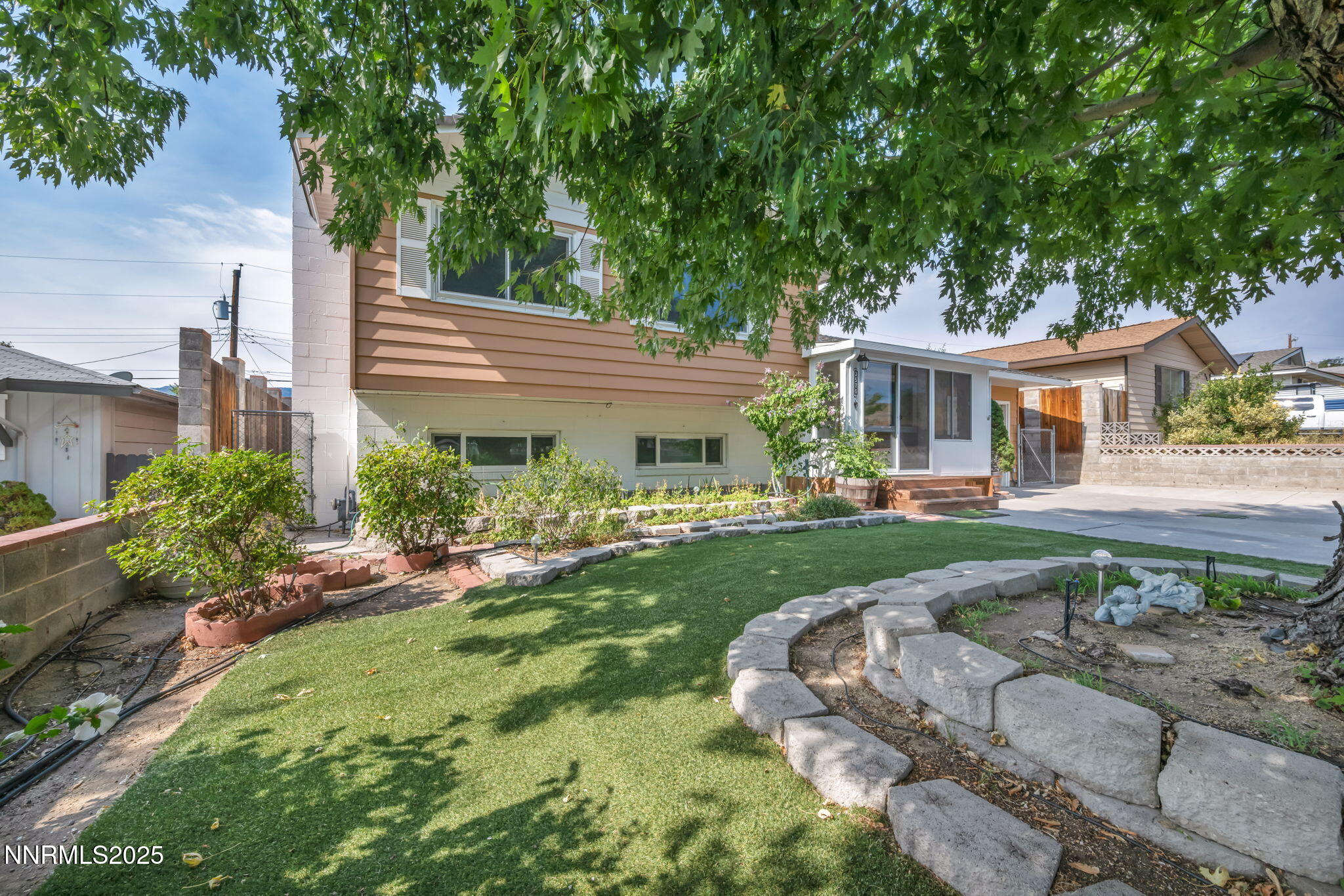 3570 West 7th Street Reno, NV 89503 - Photo 3 of 45 a front view of a house with a yard table and chairs
