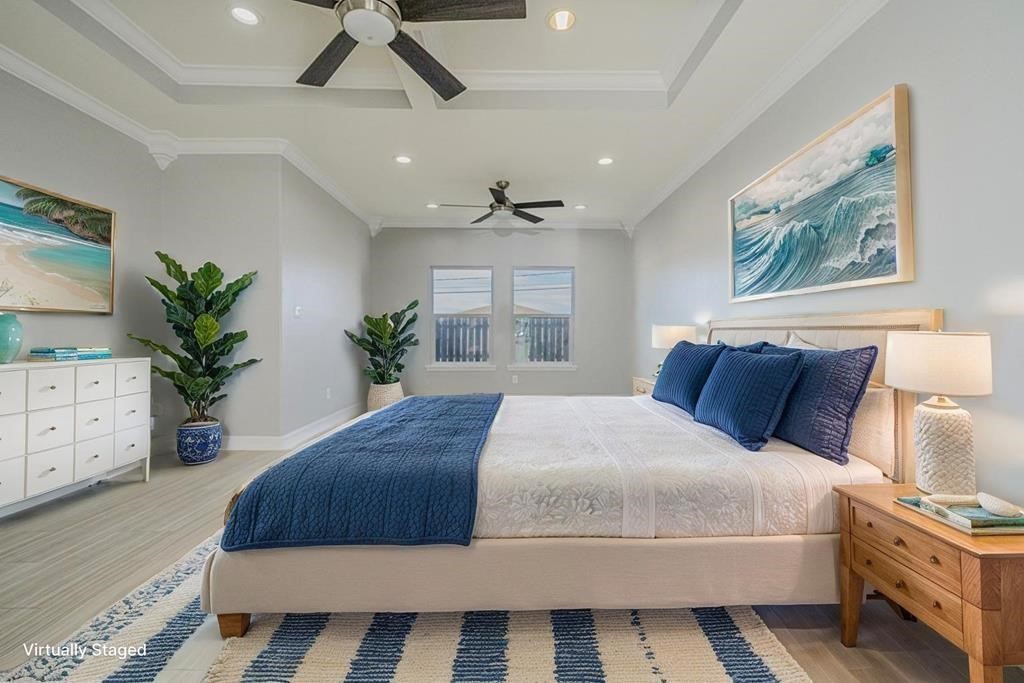 120 Sandollar Circle Fulton, TX 78382 - Photo 21 of 39 a bedroom with a large bed and a potted plant