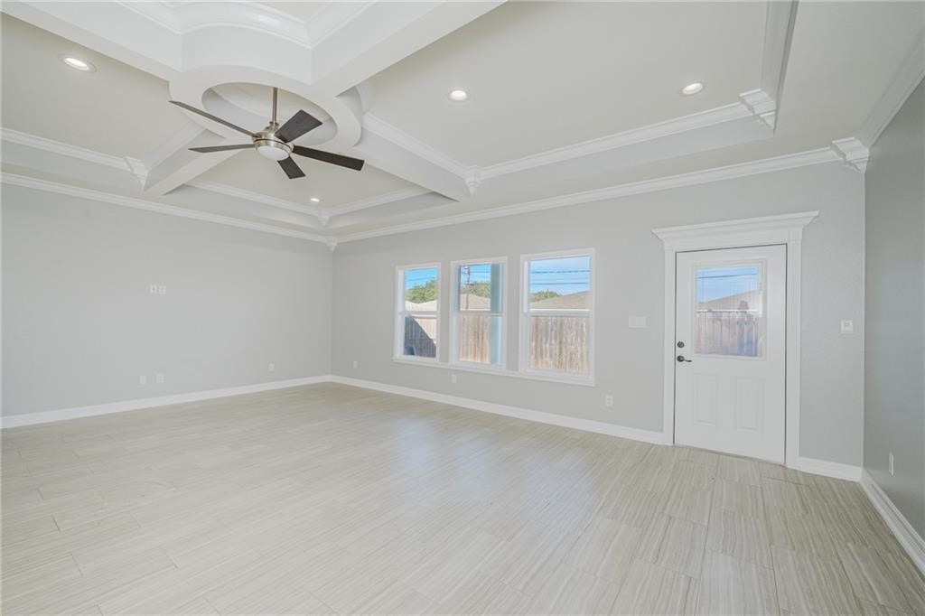 120 Sandollar Circle Fulton, TX 78382 - Photo 8 of 39 wooden floor in an empty room with a window
