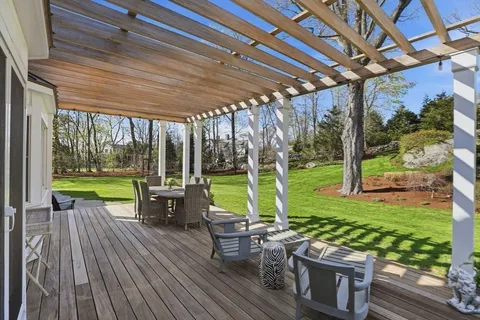 a view of swimming pool with outdoor seating