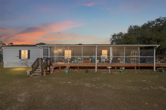 a view of a deck with wooden floor and outer view