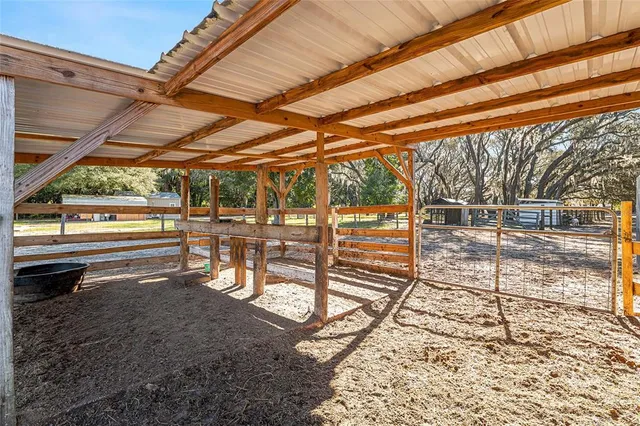 a view of a chairs with wooden fence