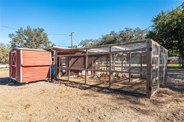 a view of a room with wooden chairs