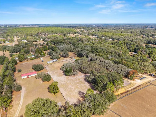 a black and white photo of a open kitchen
