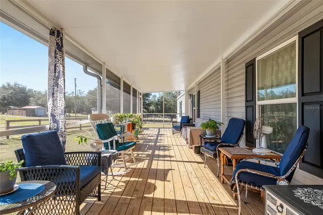 a view of a chairs and table in a patio