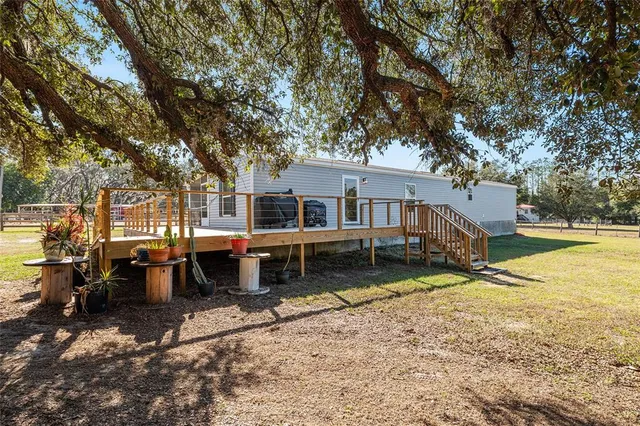 a kitchen with granite countertop a stove and a sink