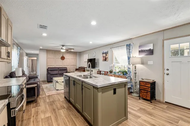 a stove top oven sitting inside of a kitchen