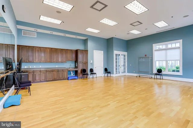 a view of a living room and kitchen