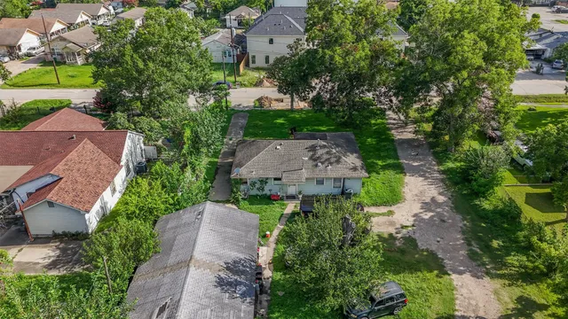 an aerial view of a house with a garden
