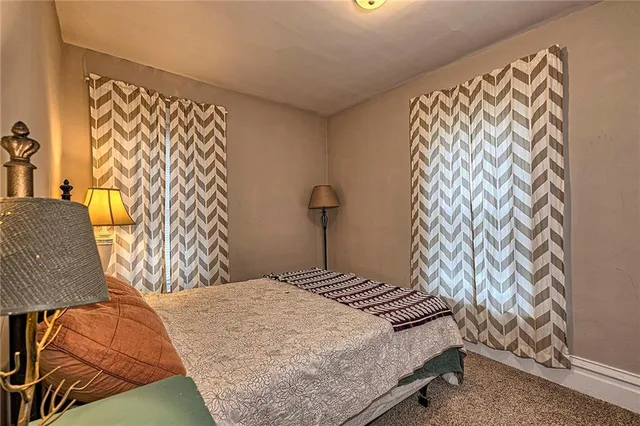 a bedroom with furniture and a window