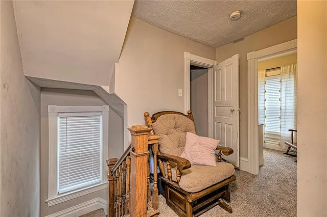 a bathroom with a sink a toilet a mirror and shower curtain