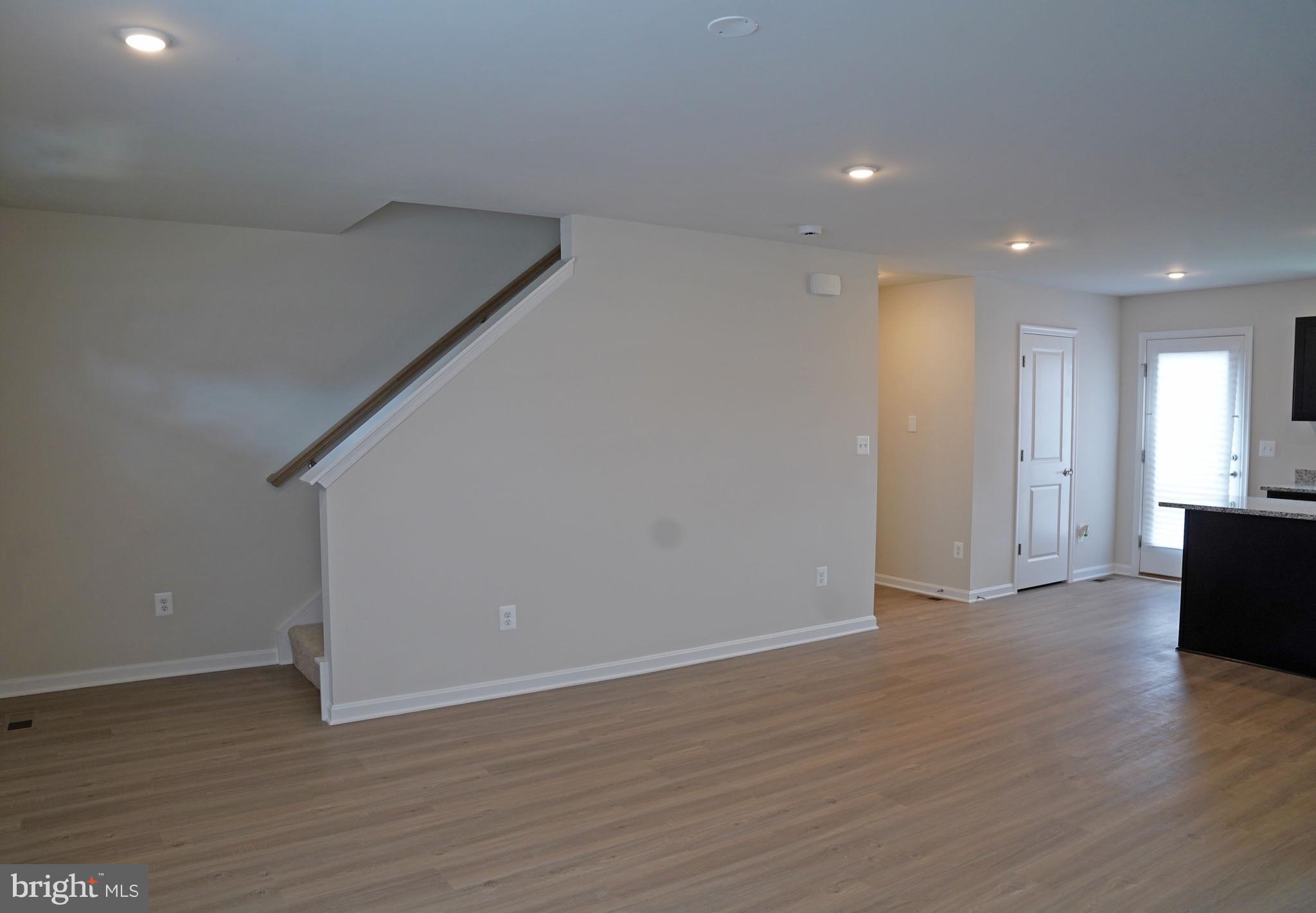 263 Ellery Street Ranson, WV 25438 - Photo 13 of 38 a view of an empty room with wooden floor and closet