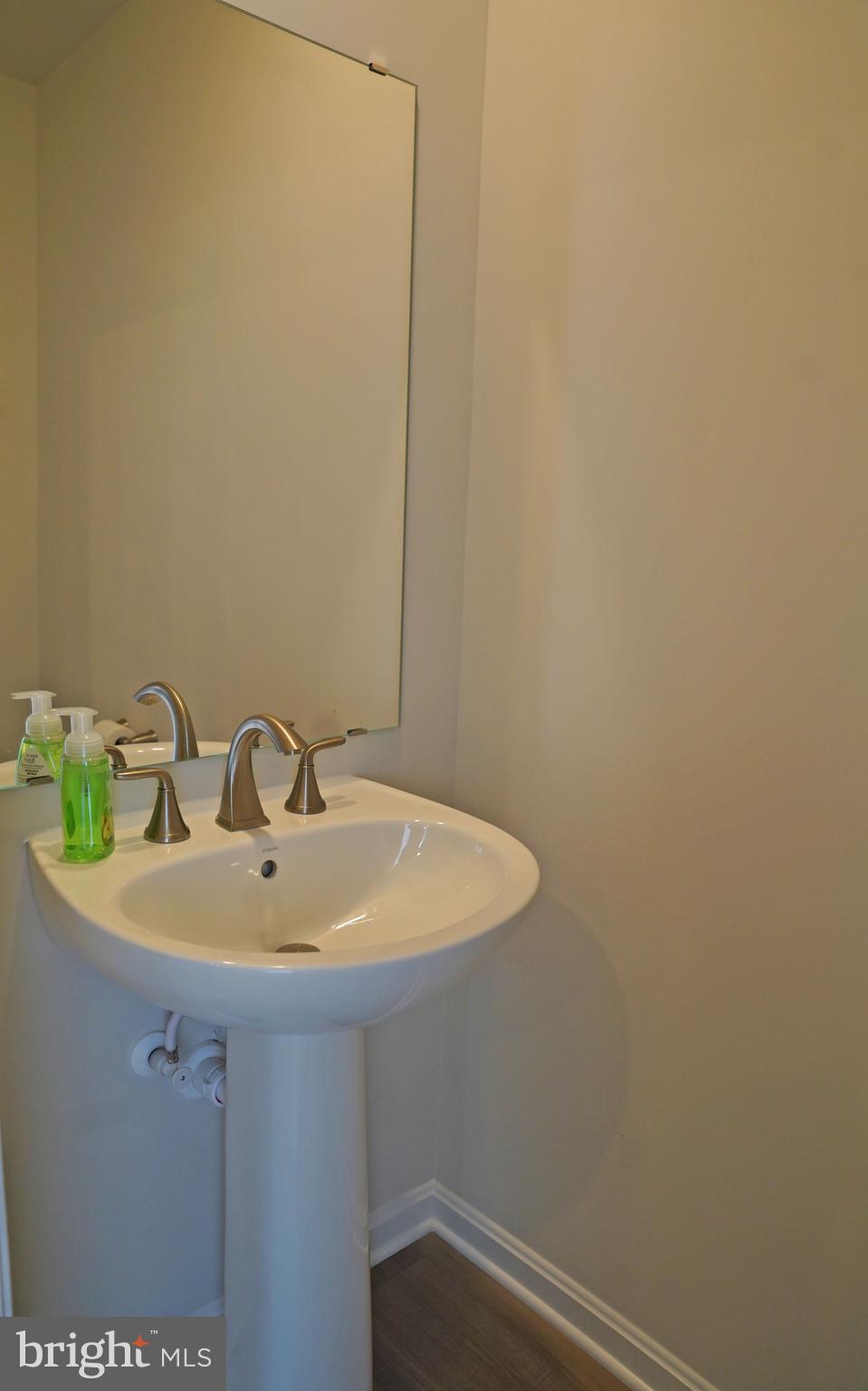 263 Ellery Street Ranson, WV 25438 - Photo 14 of 38 a bathroom with a sink and a mirror