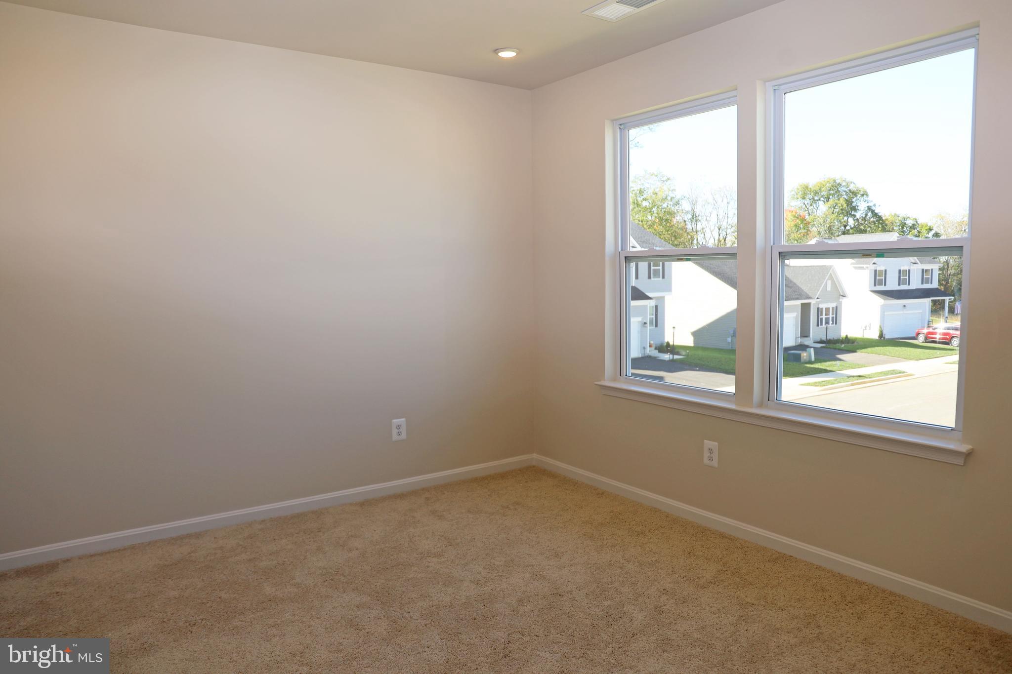 263 Ellery Street Ranson, WV 25438 - Photo 16 of 38 an empty room with windows