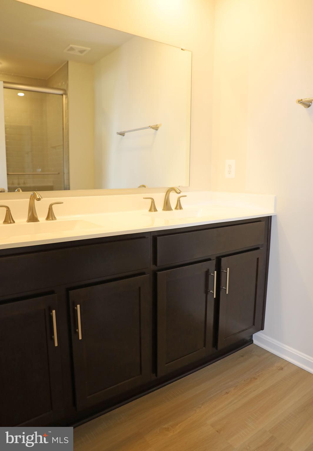 263 Ellery Street Ranson, WV 25438 - Photo 28 of 38 a bathroom with a sink and a mirror
