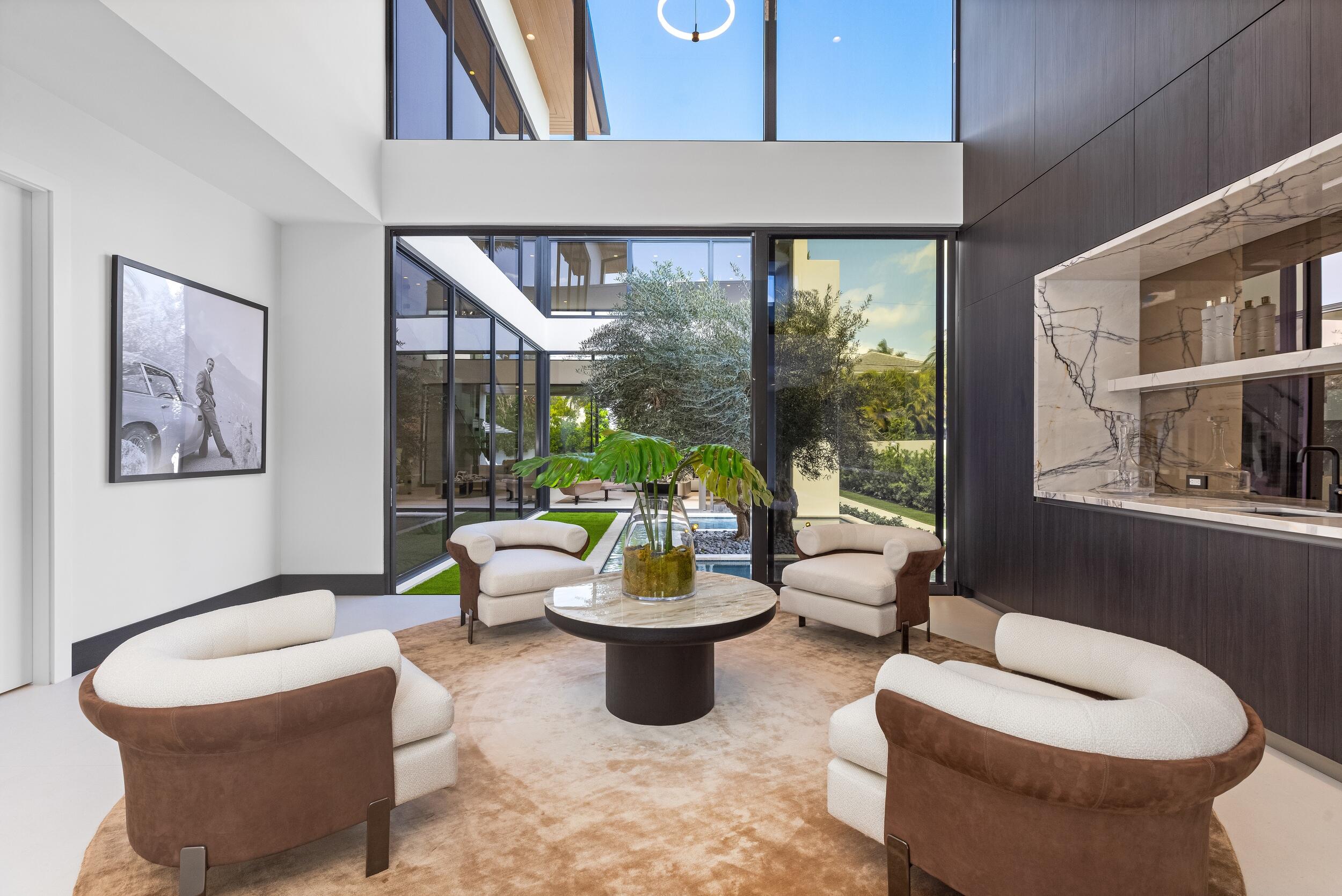 1351 Cocoanut Road Boca Raton, FL 33432 - Photo 29 of 101 a living room with furniture and a large window