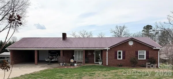 a front view of house with yard outdoor seating and green space