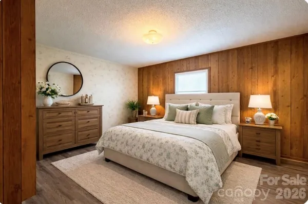 a bedroom with a bed and a dresser