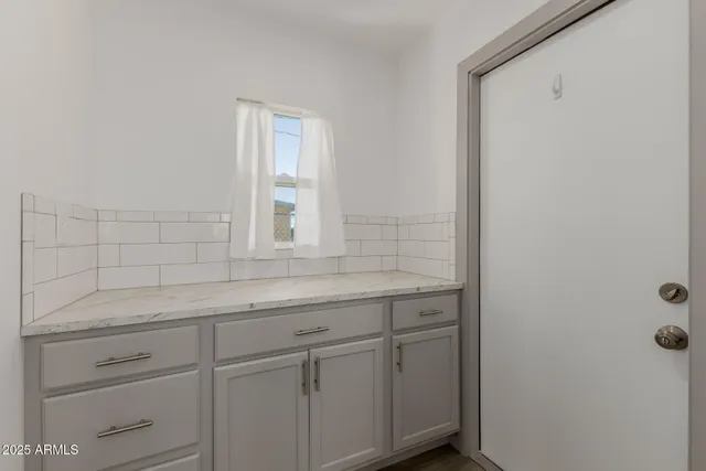 a bathroom with a sink and vanity
