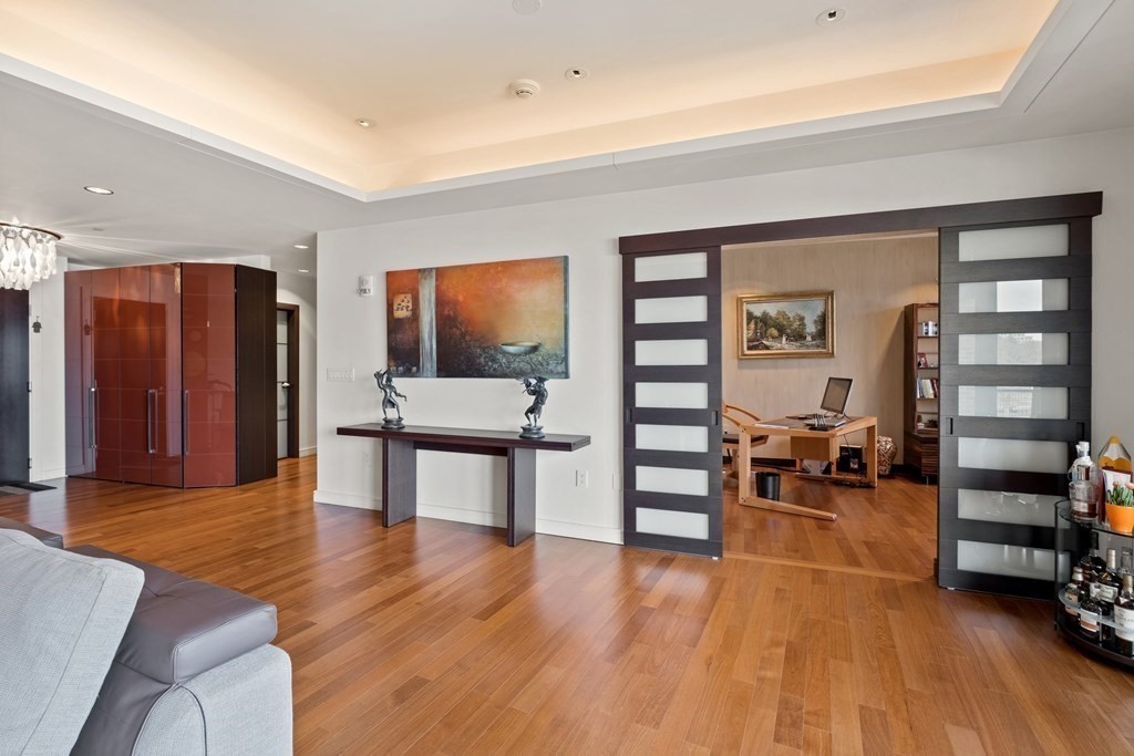 2400 Beacon Street, Unit 401 Boston, MA 02467 - Photo 11 of 35 a living room with furniture and a flat screen tv