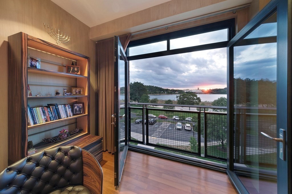 2400 Beacon Street, Unit 401 Boston, MA 02467 - Photo 14 of 35 a view of a floor to ceiling window with wooden floor