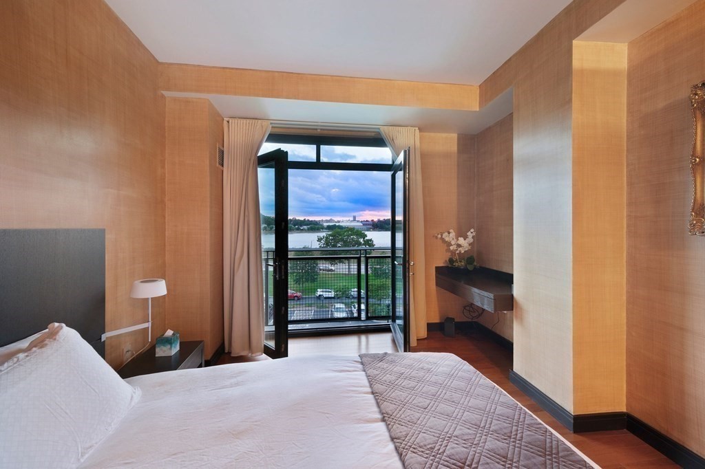 2400 Beacon Street, Unit 401 Boston, MA 02467 - Photo 19 of 35 a bedroom with a bed and large window