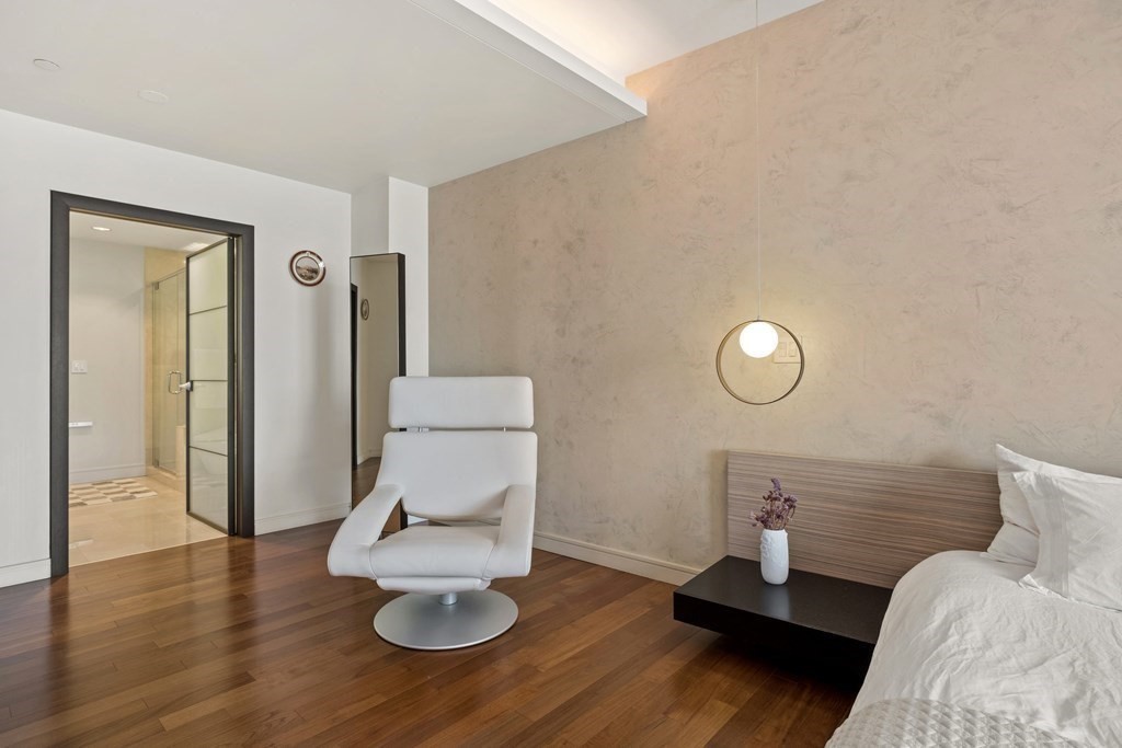 2400 Beacon Street, Unit 401 Boston, MA 02467 - Photo 22 of 35 a living room with furniture and a wooden floor