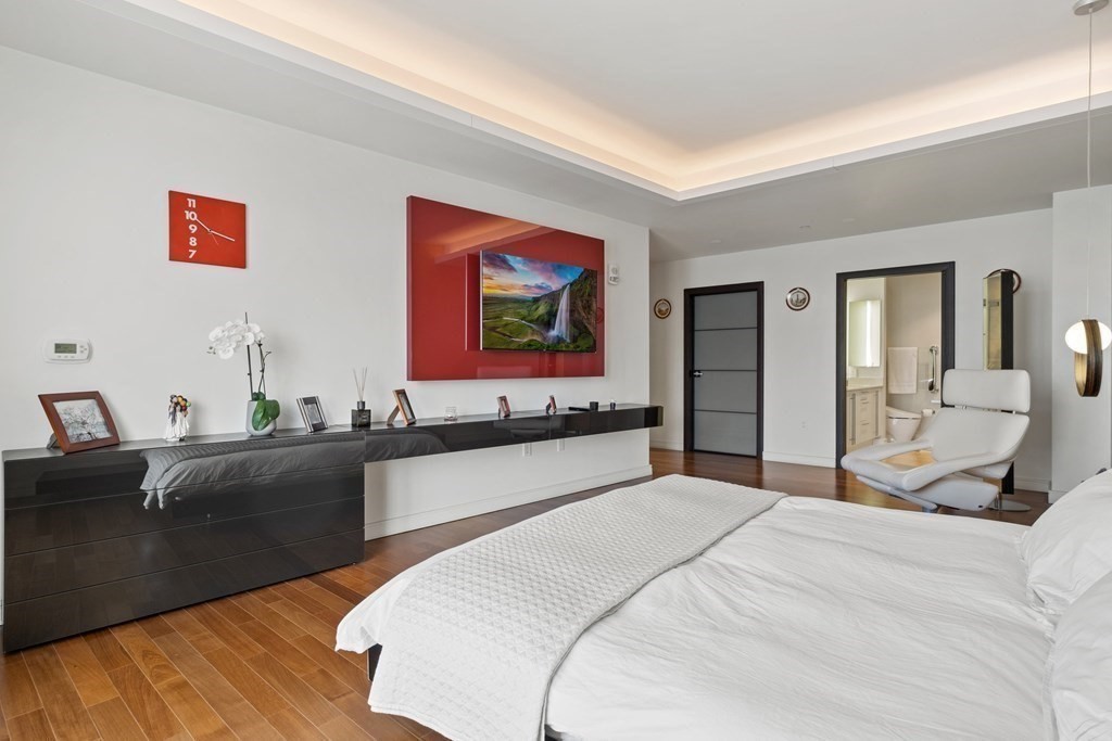 2400 Beacon Street, Unit 401 Boston, MA 02467 - Photo 24 of 35 a bedroom with a bed and a couch