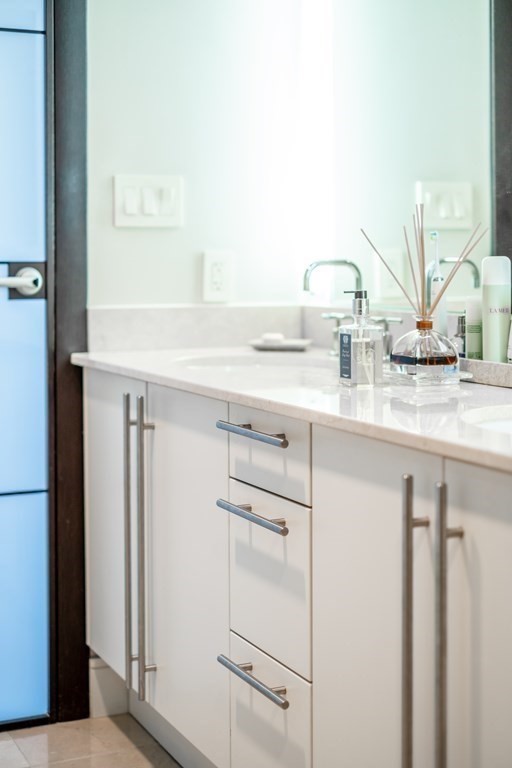 2400 Beacon Street, Unit 401 Boston, MA 02467 - Photo 26 of 35 a kitchen with appliances cabinets and a sink