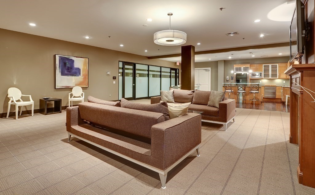 2400 Beacon Street, Unit 401 Boston, MA 02467 - Photo 30 of 35 a living room with furniture and a large window