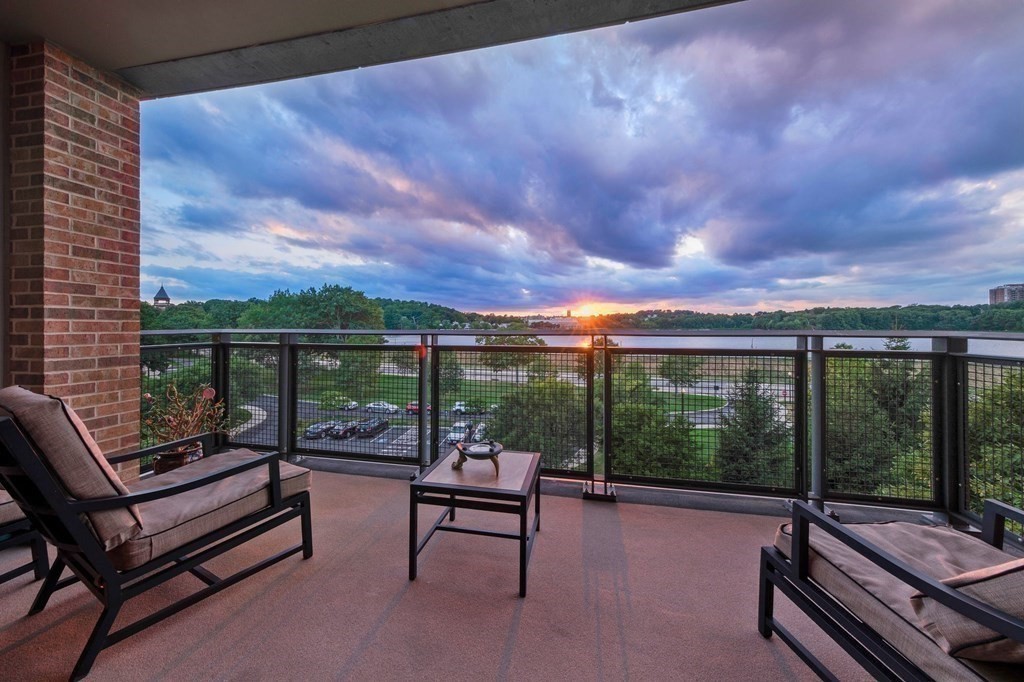 2400 Beacon Street, Unit 401 Boston, MA 02467 - Photo 4 of 35 a view of a patio with a couple of chairs and a table