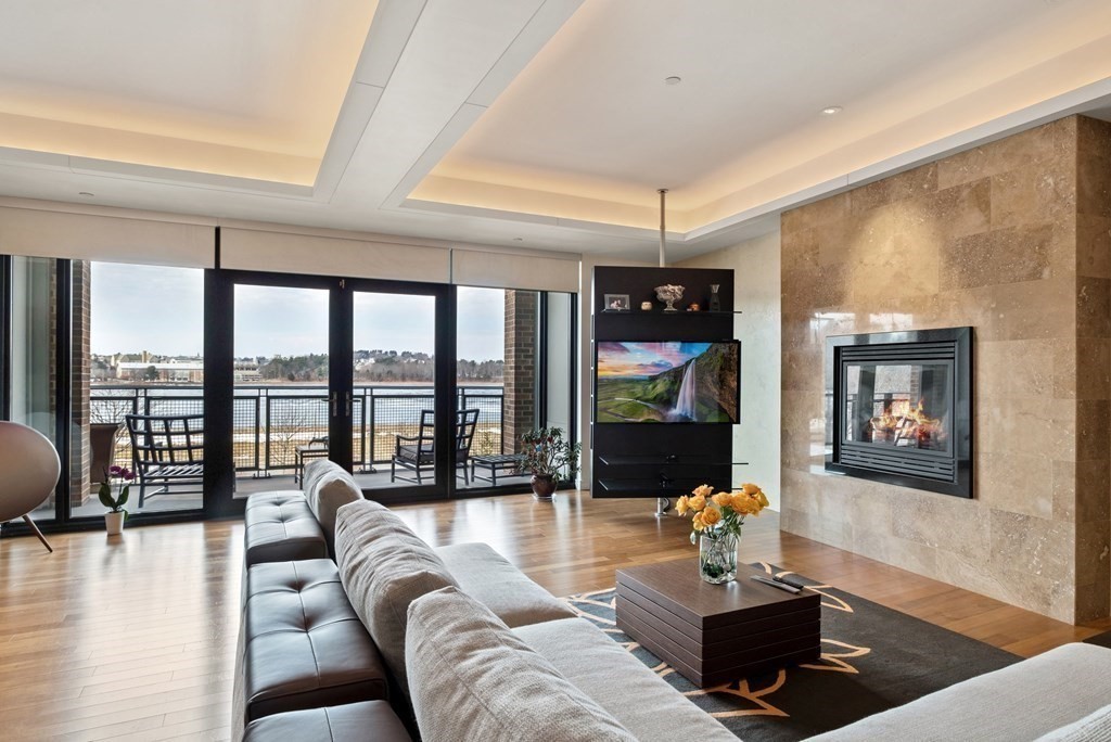 2400 Beacon Street, Unit 401 Boston, MA 02467 - Photo 10 of 35 a living room with furniture large window and wooden floor