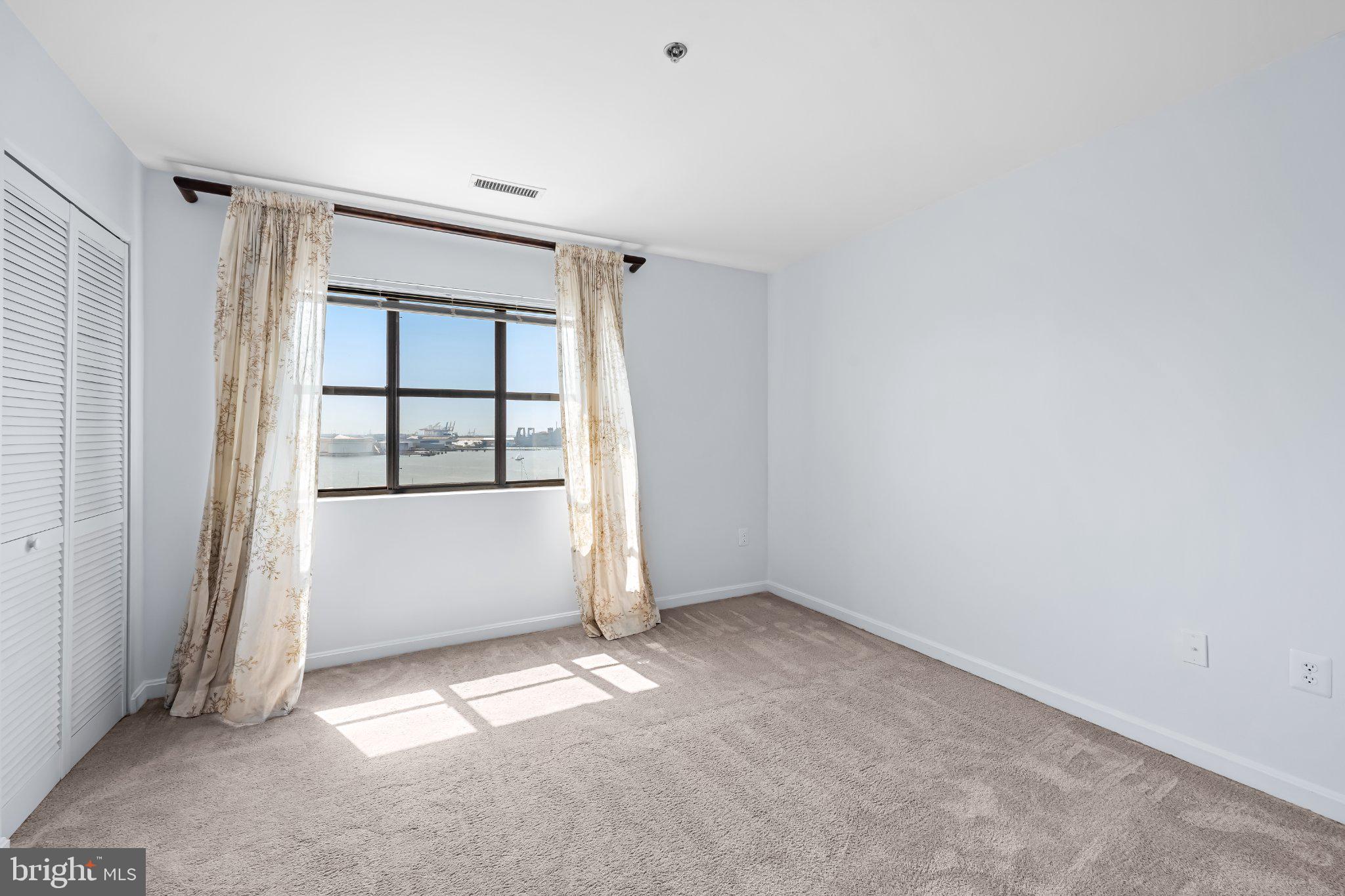 2702 Lighthouse Point East, Unit 738 Baltimore, MD 21224 - Photo 21 of 33 Bright and airy room with scenic views.