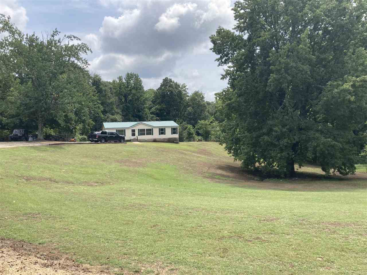 6884 Conner Whitefield Road Ripley, TN 38063 - Photo 1 of 16 a view of a lake with houses