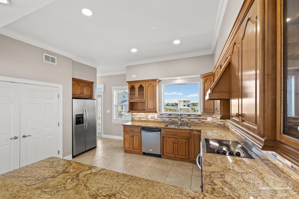 321 Gulfview Lane Perdido Key, FL 32507 - Photo 17 of 57 a kitchen with a stove a sink and a refrigerator