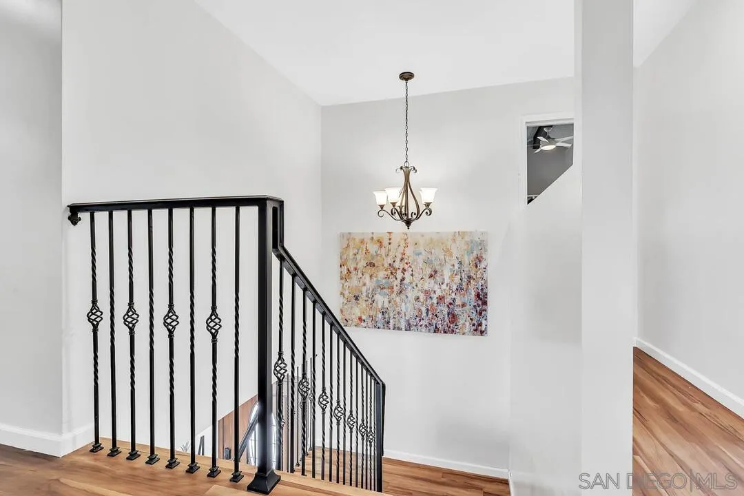 1668 Olmeda Street Encinitas, CA 92024 - Photo 16 of 42 a view of a hallway with wooden floor and stairs