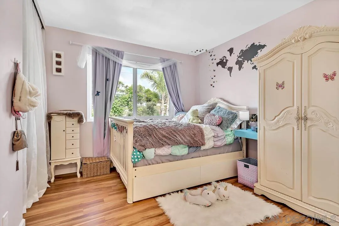 1668 Olmeda Street Encinitas, CA 92024 - Photo 17 of 42 a living room with furniture and a wooden floor