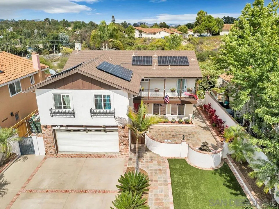 1668 Olmeda Street Encinitas, CA 92024 - Photo 2 of 42 a front view of a house with a yard