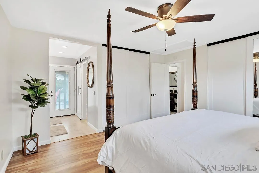 1668 Olmeda Street Encinitas, CA 92024 - Photo 21 of 42 a view of a room with a potted plant a ceiling fan and front door
